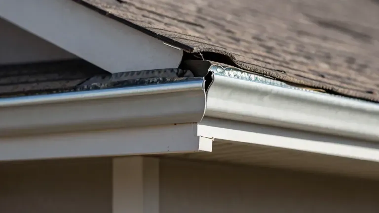 Documentary-style iPhone close-up photo of roof flashing and vent penetration inspection detail on a home in Saratoga Springs, Utah. Natural lighting.